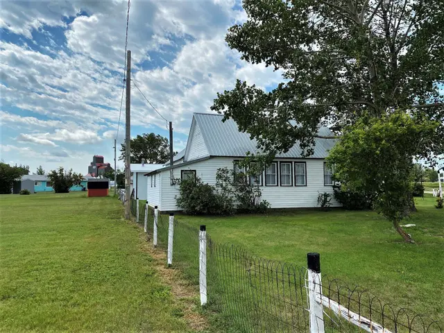 Prairie Pioneer Museum with grain elevator in the distance