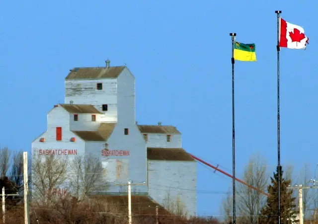 Craik grain elevator with Saskatchewan and Canadian flags